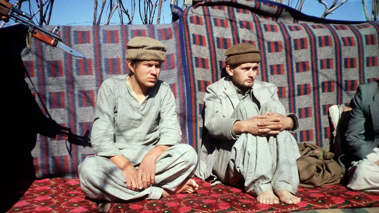 Soviet troops are held at gunpoint after being captured by Afghan fighters in 1981. File pic