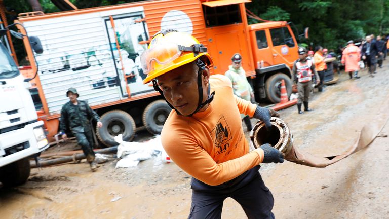 A rescue team member works near the Tham Luang cave complex, as a search for members of an under-16 soccer team continues