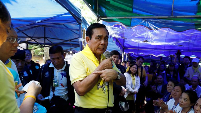 Thailand's Prime Minister Prayut Chan-o-cha speaks as he visits families anxious for news