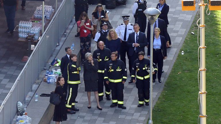 Prime Minister Theresa May visits the scene near Grenfell Tower 