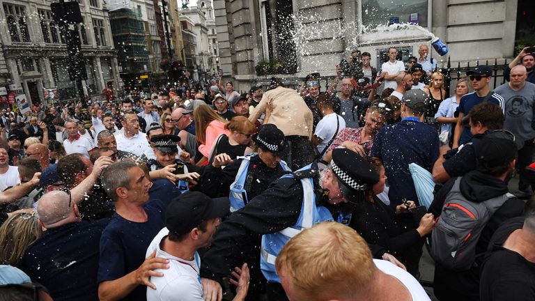 LONDON, ENGLAND - JUNE 09:  Beer is thrown as demonstrators clash with police during a &#39;Free Tommy Robinson&#39; protest on Whitehall on June 9, 2018 in London, England. Protesters are calling for the release of English Defense League (EDL) leader Tommy Robinson who is serving 13 months in prison for contempt of court.  (Photo by Chris Ratcliffe/Getty Images)