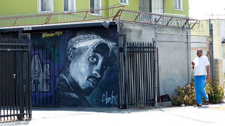 A wall dedicated to the memory of US rapper Tupac Shakur is seen on May 26, 2016 in Los Angeles, California. Twenty years after his death, Tupac still reigns. Other rappers have succeeded him in stardom, and promotional efforts around Tupac have been haphazard, but the artist who died at age 25 on September 13, 1996, in Las Vegas, maintains a hold that is among the most enduring in recent times. / AFP / VALERIE MACON / TO GO WITH AFP STORY by Shaun TANDON, &#39;20 years on, Tupac reigns as potent gl