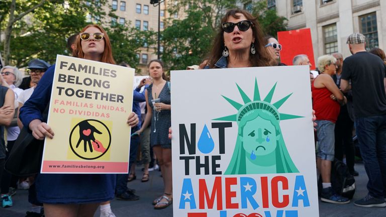 People attend a rally protesting the separation of children from their families while crossing the US border illegally on June 14, 2018 in New York