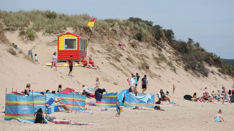 Sun bathers on the beach in Brittas Bay Co Wicklow as Ireland braces itself for the hottest weather of the year next week when it will be above 30C                