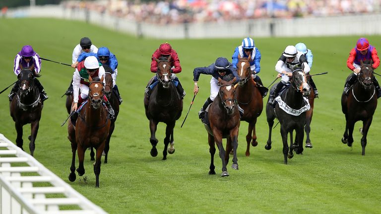 Without Parole ridden by Frankie Dettori (left, in front) coming home to win the St James&#39;s Palace Stakes 