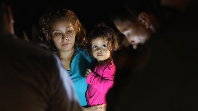 A Honduran girl, 2, and her mother, are taken into custody near the US-Mexico border