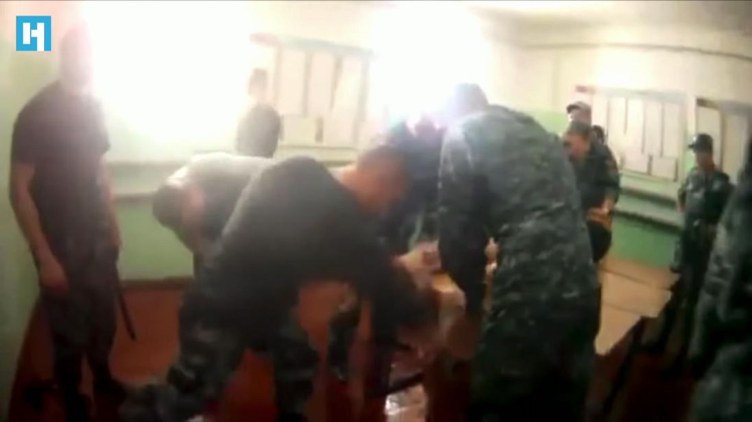 Russian Prison Guards Arrested Over Torture Of Inmate
