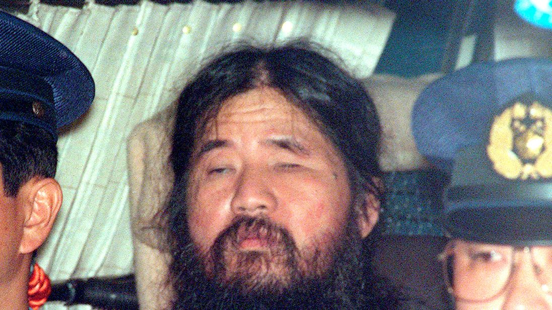 Japanese doomsday cult leader Shoko Asahara sits in a police van following an interrogation in Tokyo, Japan, in this photo taken by Kyodo September 25, 1995. Mandatory credit Kyodo/via REUTERS ATTENTION EDITORS - THIS IMAGE WAS PROVIDED BY A THIRD PARTY. MANDATORY CREDIT. JAPAN OUT. NO COMMERCIAL OR EDITORIAL SALES IN JAPAN.