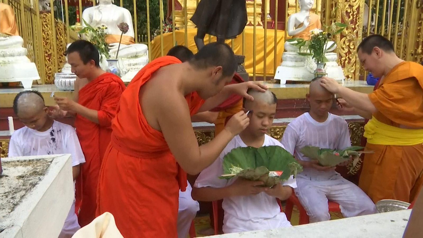 Thai cave rescue: Boys have heads shaved to become Buddhist monk