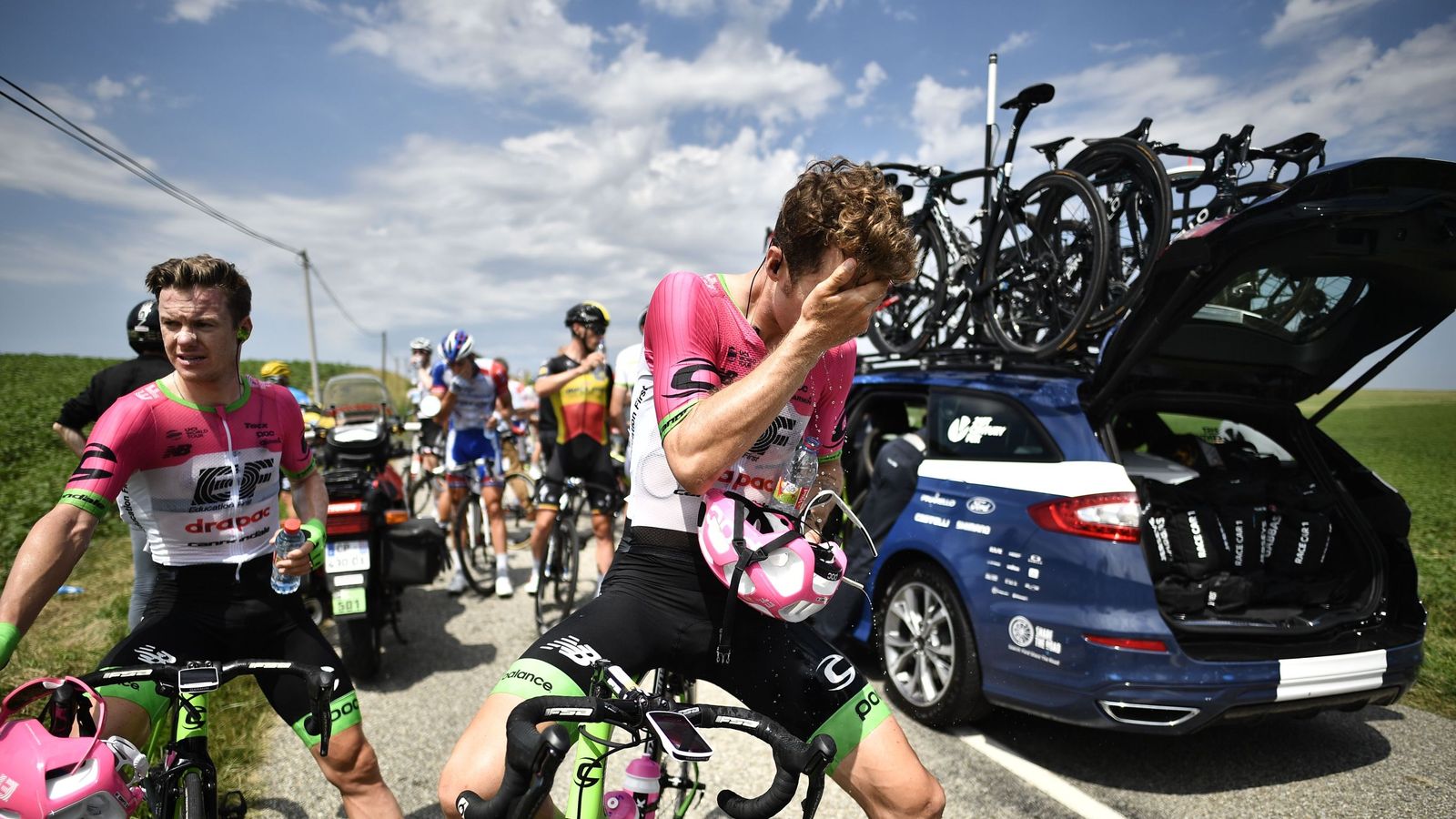 Tour de France briefly halted by protest as riders hit with pepper