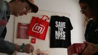 Momentum volunteers arrange souvenirs at The World Transformed event on the sidelines of the Labour party conference in Brighton on September 23, 2017. Britain's revitalised Labour opposition kicks off its annual conference on Sunday with leader Jeremy Corbyn set to lay out his party's agenda, free from the leadership challenges of previous years. / AFP PHOTO / Daniel LEAL-OLIVAS (Photo credit should read DANIEL LEAL-OLIVAS/AFP/Getty Images)
