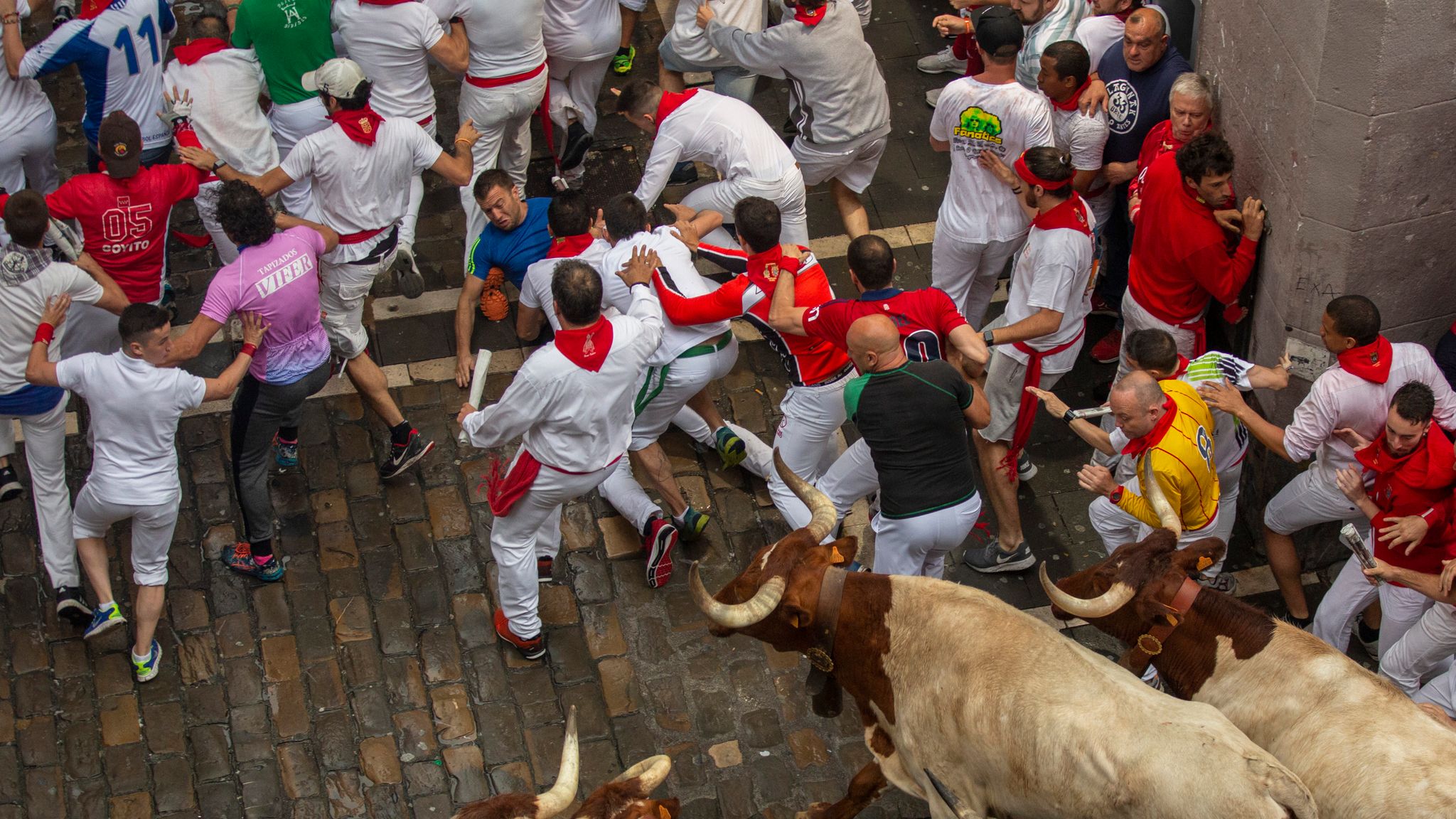 Man gored and four badly injured on first day of Pamplona bull run