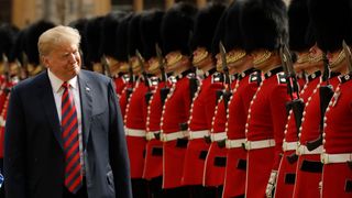   Donald Trump inspects a guard of honor, formed Coldstream Guards at Windsor Castle in Windsor, England on Friday July 13, 2018 