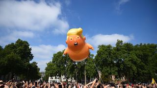 A 'Baby Trump' balloon rises after being inflated in London's Parliament Square