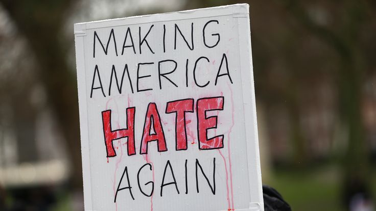 A demonstrator holds a banner that reads "Making America Hate Again", during a march against U.S. President Donald Trump and his temporary ban on refugees and nationals from seven Muslim-majority countries from entering the United States, in London, Britain