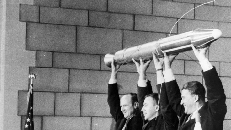   of Explorer 1 taking a model at the press conference on launch day (or the day before), February 1, 1958 (or January 31, 1958). From left: Dr. William Pickering, Ph.D. James Van Allen, Ph.D. Wernher von Braun 