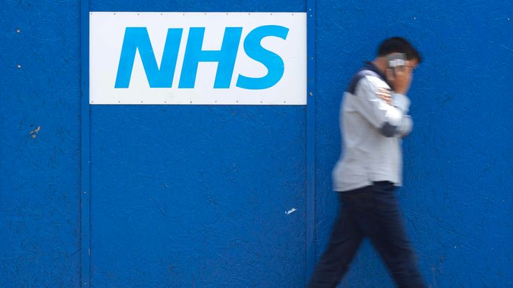 A man walks past an NHS signage outside The Royal London Hospital in London on May 14, 2017. The unprecedented global cyberattack has hit more than 200,000 victims in scores of countries, Europol said on May 14, 2017, warning that the situation could escalate when people return to work. In Britain, the attack disrupted care at National Health Service facilities, including The Royal London Hospital, part of the largest NHS Trust in England. / AFP PHOTO / Niklas HALLE'N (Photo credit should read N