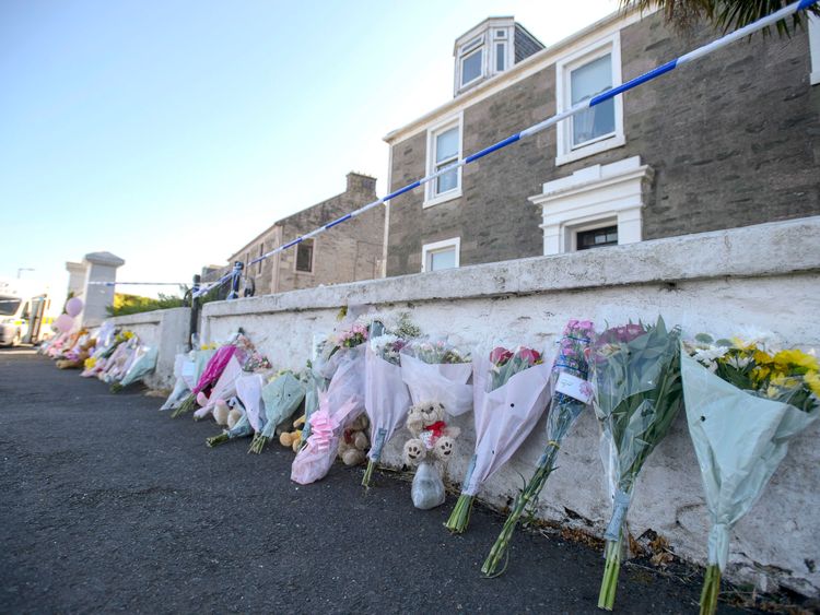 Flowers are left outside the house that Alesha went missing from