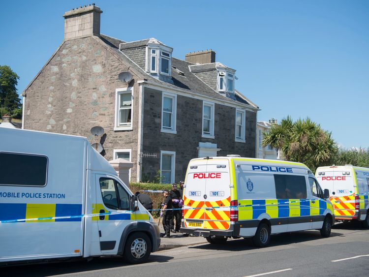 Police vans outside the house from where Alesha MacPhail went missing
