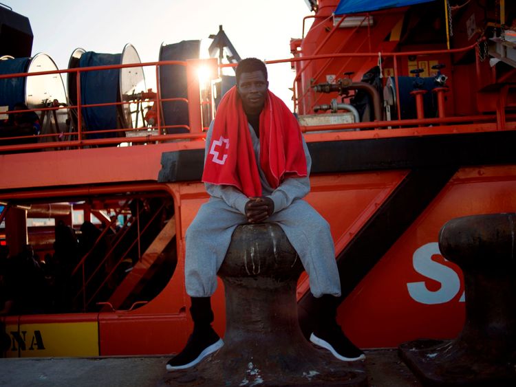 A man rescued at sea waits to be transferred at the harbour of Algeciras 