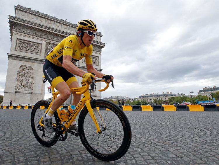 The 116-km Stage 21 from Houilles to Paris Champs-Elysees - July 29, 2018 - Team Sky rider Geraint Thomas of Britain, wearing the overall leader's yellow jersey, passes the Arc de Triomphe in the peloton