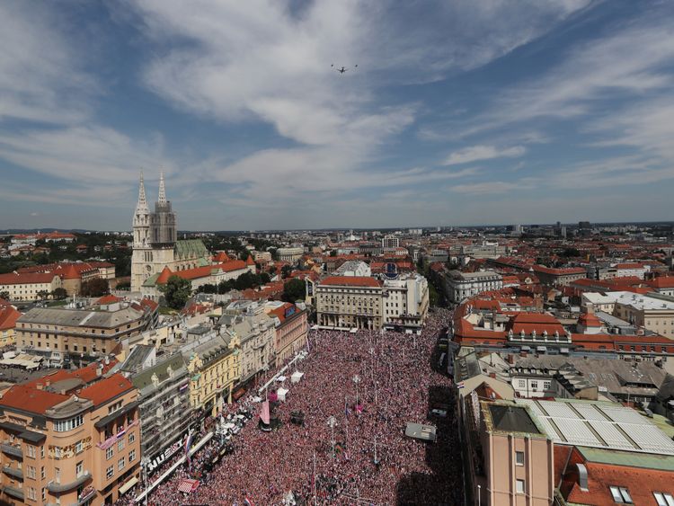 Fans await the arrival of the Croatia football team following the World Cup final