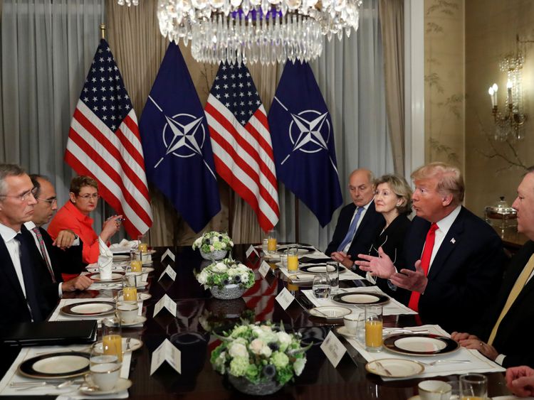 Donald Trump and NATO Secretary General Jens Stoltenberg attend a bilateral breakfast ahead of the NATO Summit in Brussels