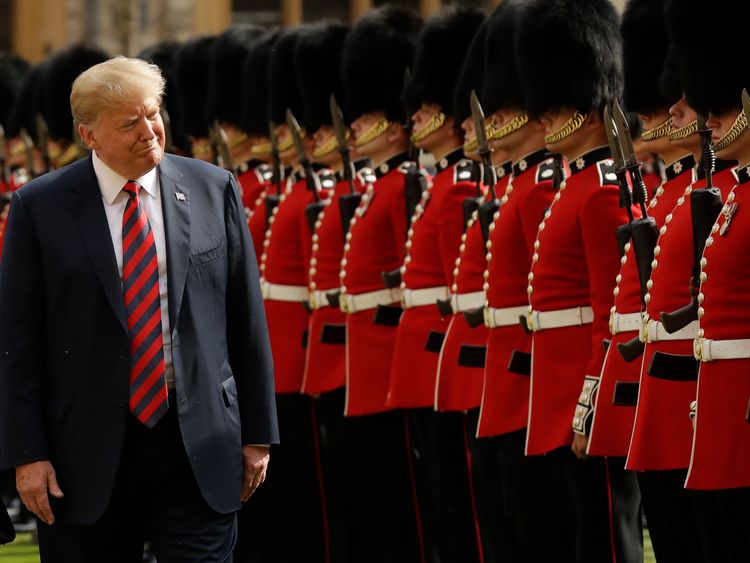 Donald Trump inspects a Guard of Honour, formed of the Coldstream Guards at Windsor Castle in Windsor, England, Friday, July 13, 2018