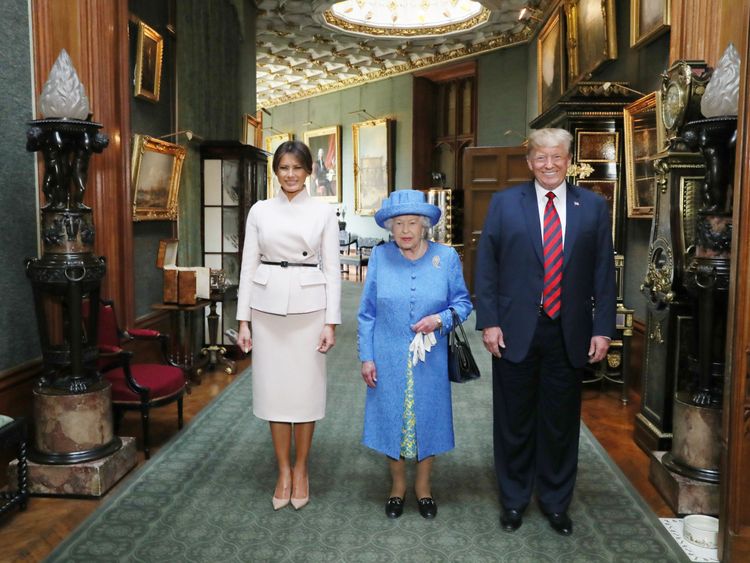 Queen Elizabeth stands with Donald Trump and his wife, Melania, in the Grand Corridor during their visit to Windsor Castle