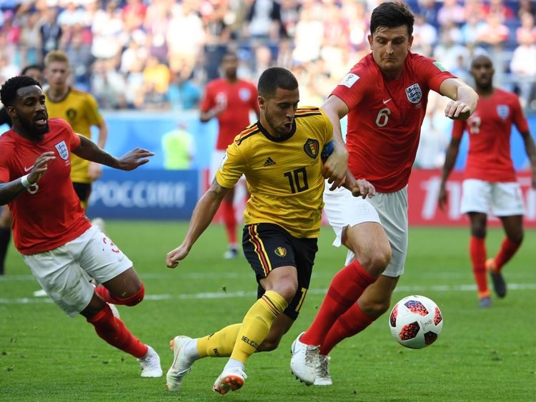 Belgium's forward Eden Hazard (C) runs with the ball past England's defender Danny Rose (L) and England's defender Harry Maguire during their Russia 2018 World Cup play-off for third place football match between Belgium and England at the Saint Petersburg Stadium in Saint Petersburg on July 14, 2018. (Photo by Paul ELLIS / AFP) / RESTRICTED TO EDITORIAL USE - NO MOBILE PUSH ALERTS/DOWNLOADS (Photo credit should read PAUL ELLIS/AFP/Getty Images) 