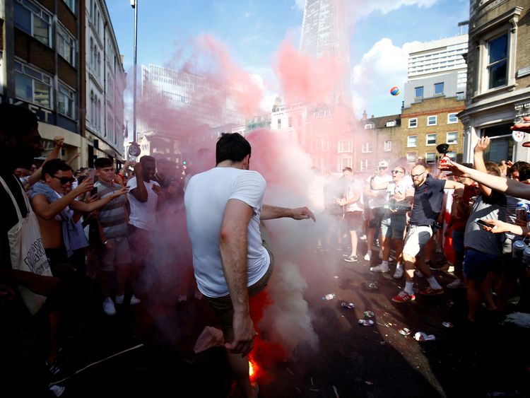 England fans set off smoke bombs after the match
