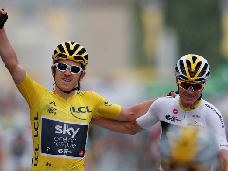 Team Sky rider Geraint Thomas of Britain, wearing the overall leader's yellow jersey, celebrates as he finishes with teammate Chris Froome