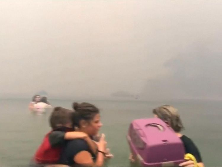 Hundreds fled into the water to try to survive the fire