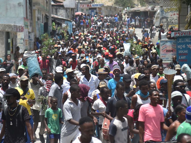 Demonstrators marched through the streets of Port-au-Prince against the government