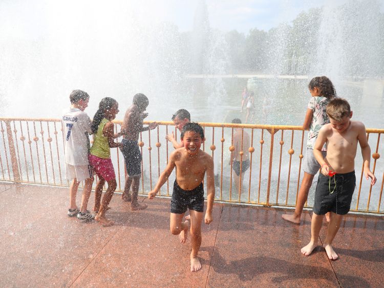 Children play in fountains in London's Battersea Park