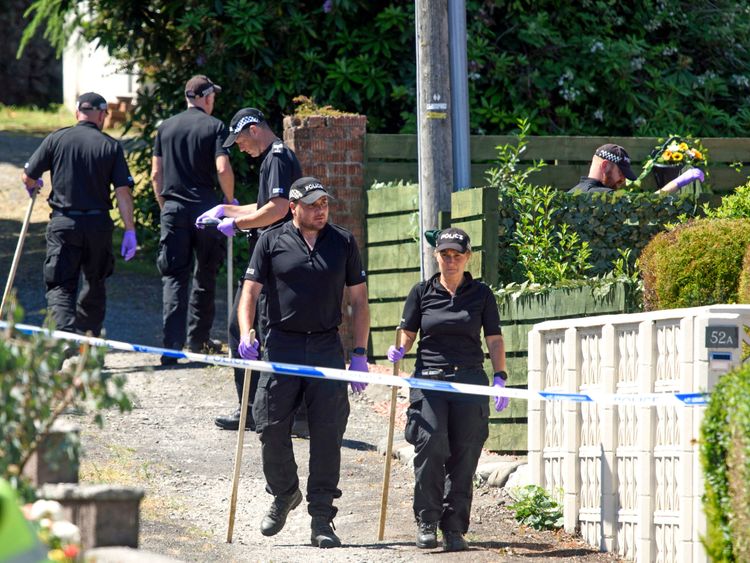 Teams of police are searching for evidence on Ardbeg Road