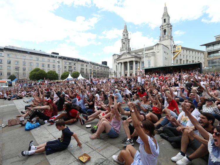 England fans react as they watch the match in Millennium Square, Leeds 