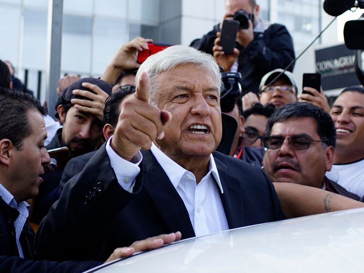 Presidential candidate Andres Manuel Lopez Obrador talks to reporters as he departs after casting his ballot at a polling station during the presidential election in Mexico City, Mexico, July 1, 2018