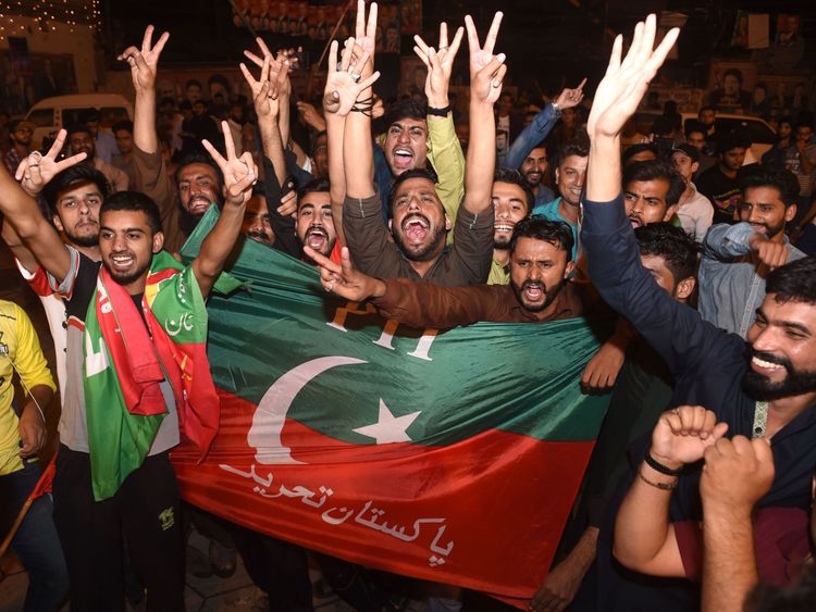 Supporters of Pakistan&#39;s cricketer-turned politician Imran Khan, head of the Pakistan Tehreek-e-Insaf (Movement for Justice) party, celebrate in Lahore