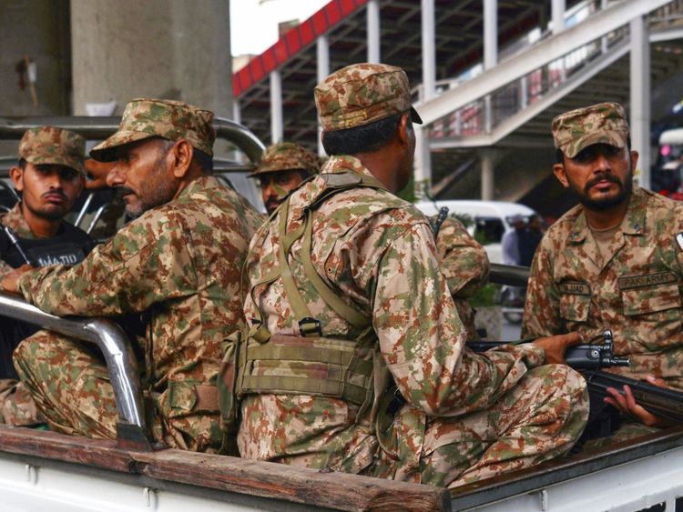 Pakistani soldiers sit on a truck during a patrol on a street in Rawalpindi on July 23, 2018. - Pakistan will hold the general election on July 25