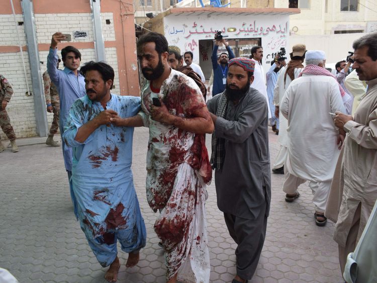 Injured are taken to hospital after a suicide bomber hits Pakistan