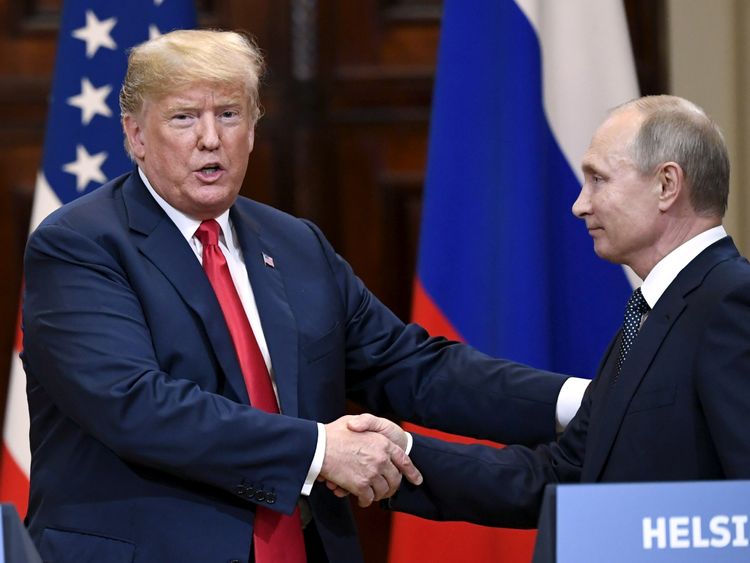 U.S. President Donald Trump and Russia's President Vladimir Putin shake hands after their joint news conference in the Presidential Palace in Helsinki, Finland