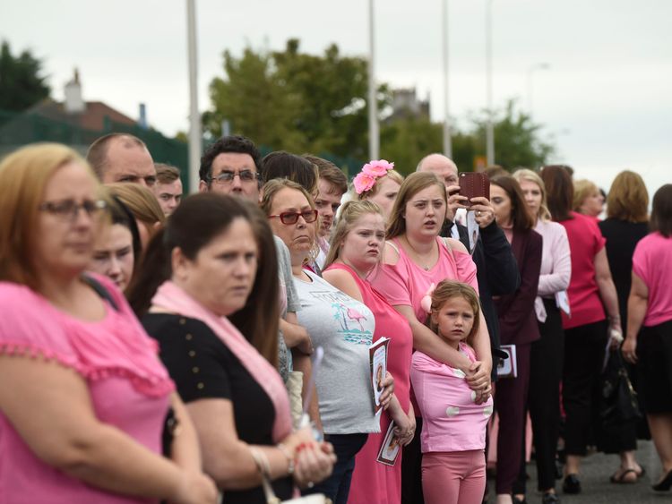 Members of the public watch the funeral cortege at the Coats Funeral Home, in Coatbridge, prior to the funeral of six-year-old Alesha MacPhail, whose body was found on the Isle of Bute earlier this month. PRESS ASSOCIATION Photo. Picture date: Saturday July 21, 2018. A 16 year old male is charged with the rape and murder of Alesha on the Isle of Bute. See PA story FUNERAL Bute. Photo credit should read: Lesley Martin/PA Wire  