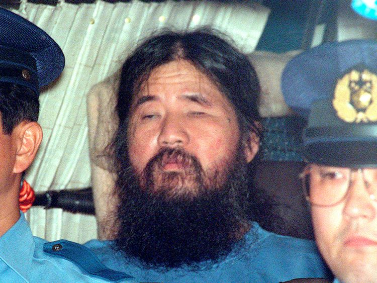 Japanese doomsday cult leader Shoko Asahara sits in a police van following an interrogation in Tokyo, Japan, in this photo taken by Kyodo September 25, 1995. Mandatory credit Kyodo/via REUTERS ATTENTION EDITORS - THIS IMAGE WAS PROVIDED BY A THIRD PARTY. MANDATORY CREDIT. JAPAN OUT. NO COMMERCIAL OR EDITORIAL SALES IN JAPAN.