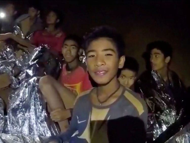 Boys from the under-16 soccer team trapped inside Tham Luang cave covered in hypothermia blankets