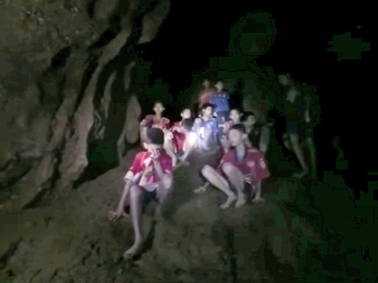 Boys from an under-16 soccer team and their coach wait to be rescued after they were trapped inside a flooded cave in Chiang Rai, Thailand