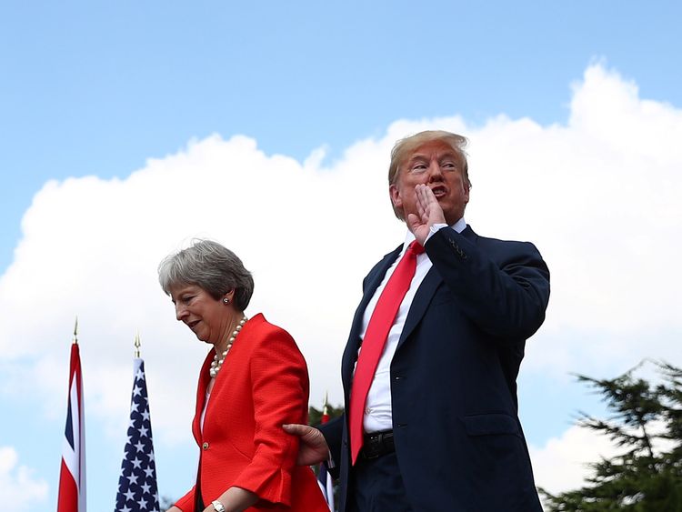 Theresa May and Donald Trump walk away after holding a joint news conference at Chequers