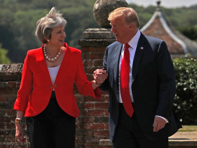 Britain's Prime Minister Theresa May and U.S. President Donald Trump walk to a joint news conference at Chequers, the official country residence of the Prime Minister, near Aylesbury, Britain, July 13, 2018