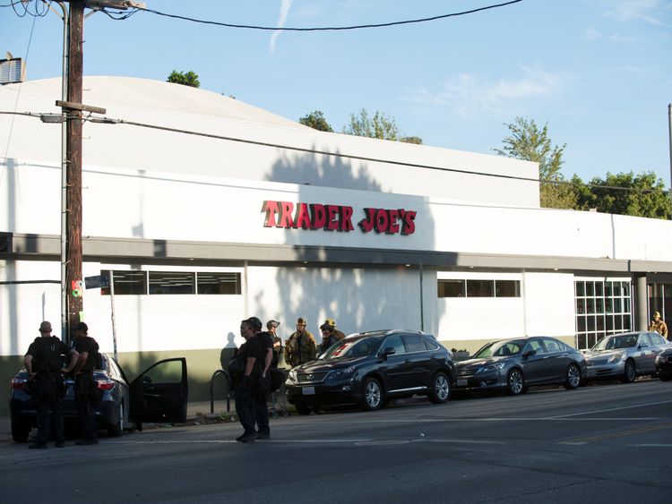 The man ran into a Trader Joe's supermarket