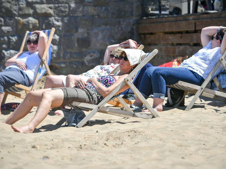 Sunseekers enjoy the hot weather on the beach at Weston-super-Mare